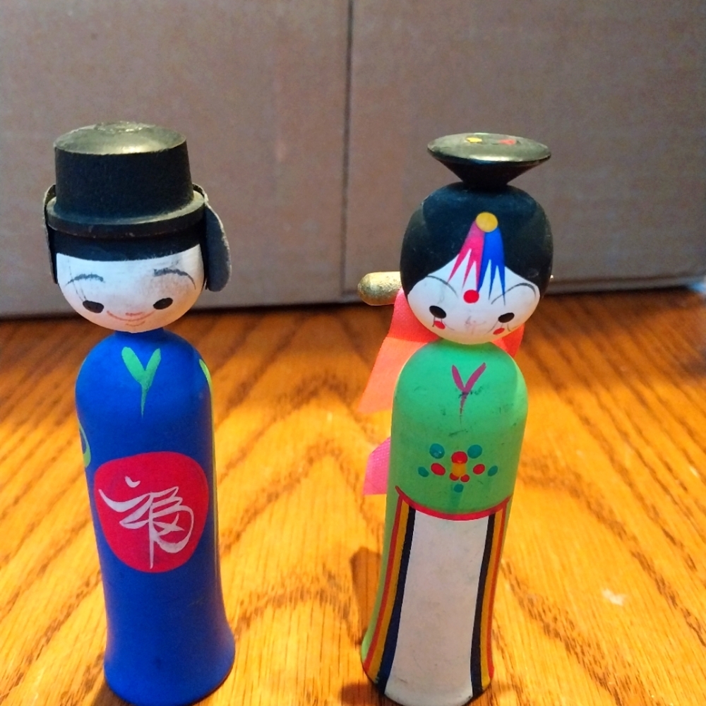 Hand painted wooden Asian peg dolls.